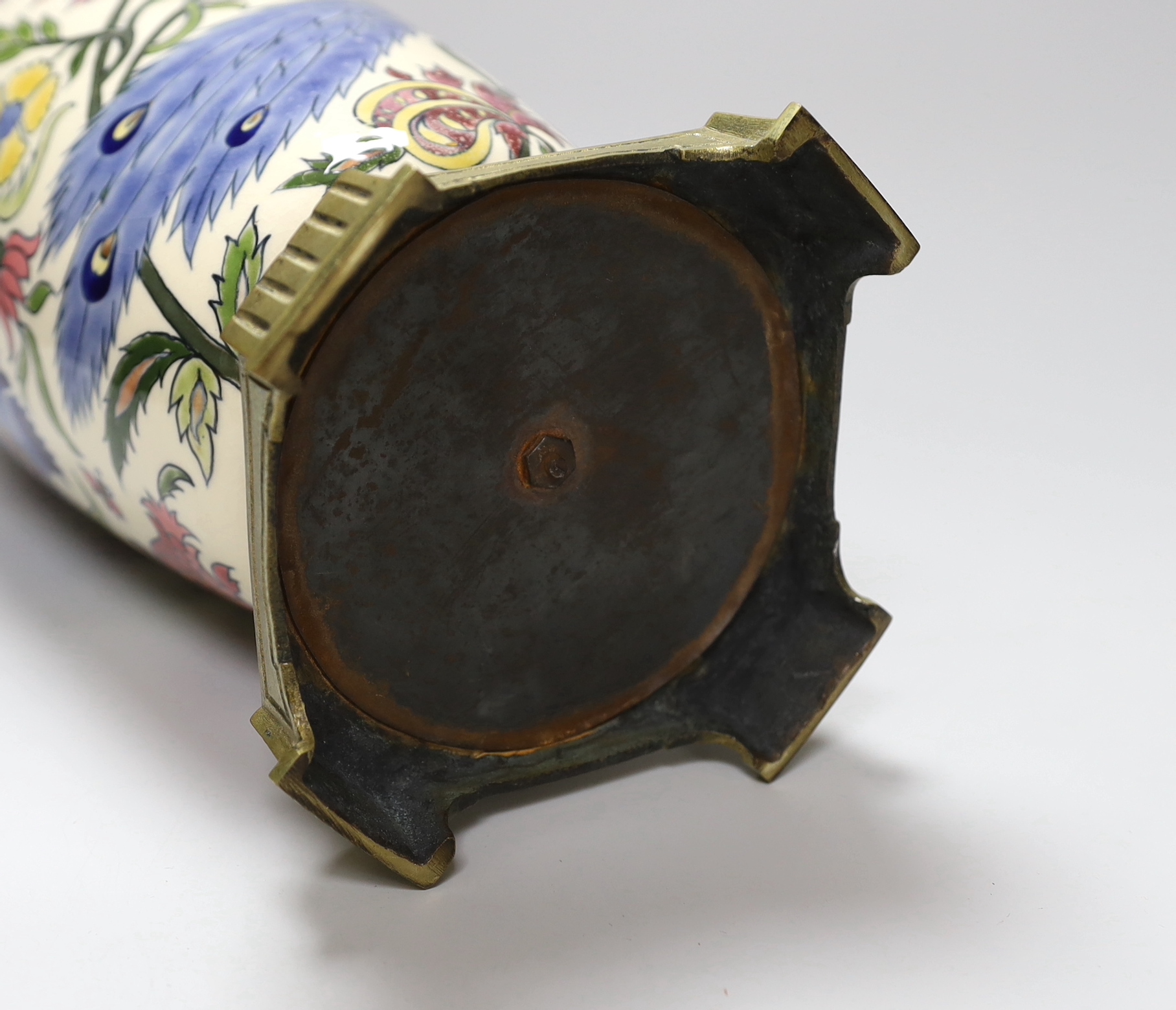 A Zsolnay Pecs brass mounted vase decorated with a peacock amongst flowers, 30cm high